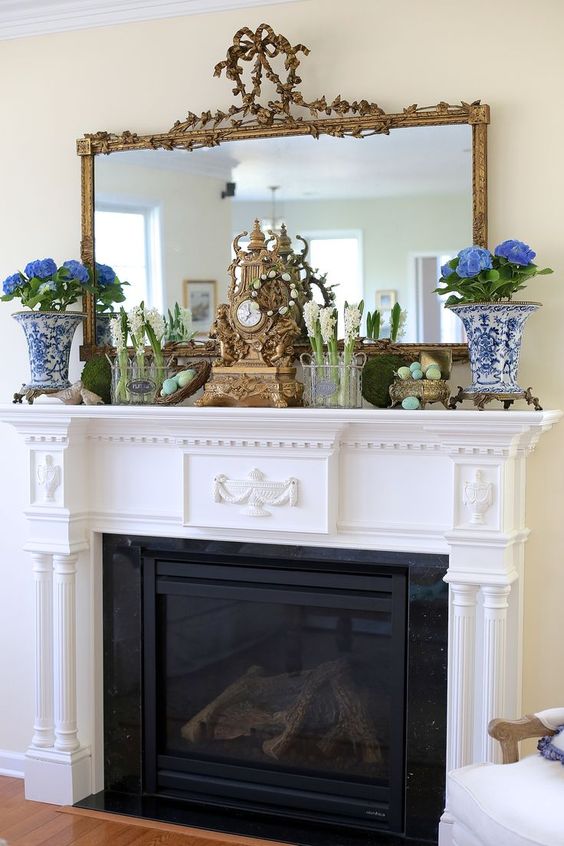 potted flowers and spring bulbs, moss balls and colorful eggs in a silver sugarpot for a refined spring mantel