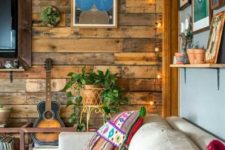 23 enliven a reclaimed wooden wall with string lights