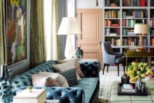 26 an eclectic living room with a muted blue velvet sofa and other touches of color for interest