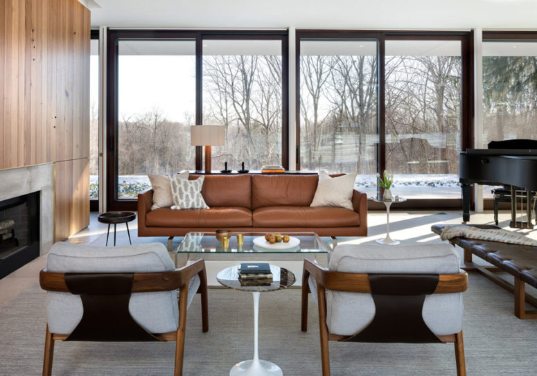A black piano isn't only for playing, it adds sophistication to the space, and the whole room is filled with light going from the glazed walls A black piano isn't only for playing, it adds sophistication to the space, and the whole room is filled with light going from the glazed walls