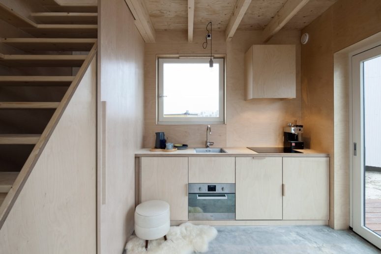 The interiors are placed on three floors and the decor is minimalist, done with light colored plywood, which was used for the furniture too The interiors are placed on three floors and the decor is minimalist, done with light-colored plywood, which was used for the furniture too