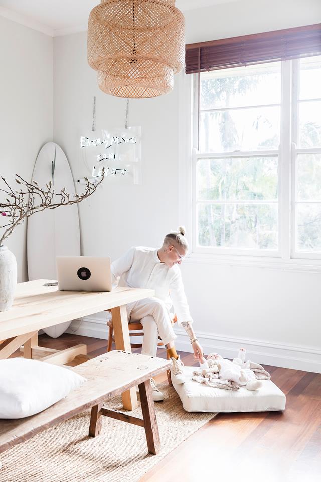 The dining space is also used as a home office, and I love a surf board in the corner, it hints on the hobbies of the owners