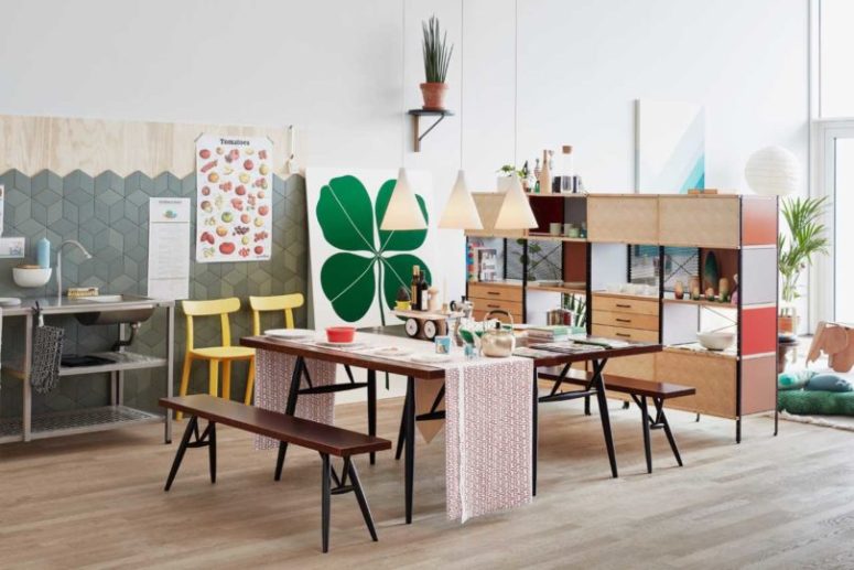 open space with lots of storage The kitchen and dining space are united into one open layout with colorful posters, bright furniture and much storage space