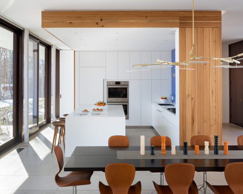 kitchen with hidden lights The kitchen block features its own ceiling with built-in lights and wood cladding the side and ceiling