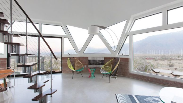 You can see a very bold and interesting staircase and colorful mid century and free spirited furniture You can see a very bold and interesting staircase and colorful mid-century and free-spirited furniture