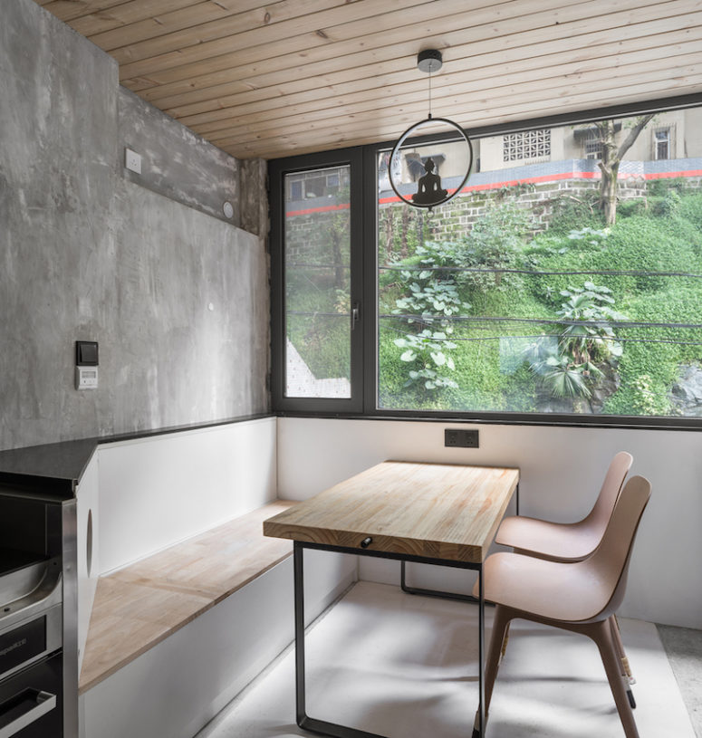 stylish bench with storage The dining space features a storage bench and cool views