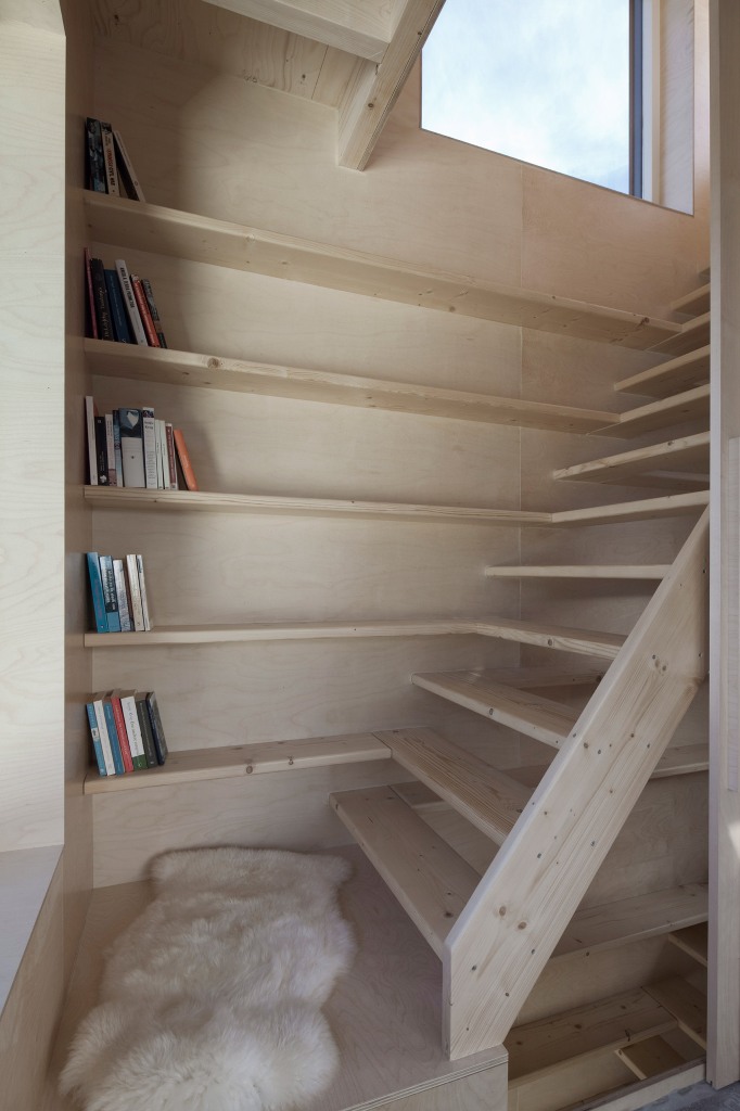 compact staircase storage solution The stairs are prolonged with bookshelves, so every inch of space is used at its best, there's no unnecessary item