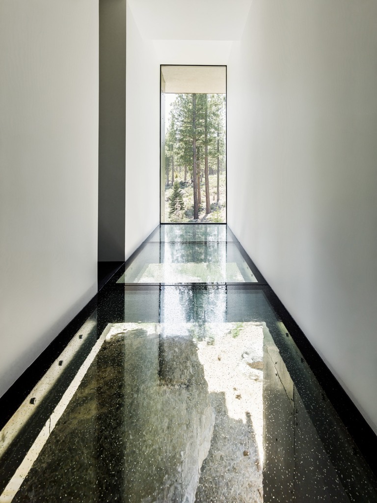 Glass floors here visually remove the boundaries and make the house more light filled, there's a large double height window Glass floors here visually remove the boundaries and make the house more light-filled, there's a large double height window