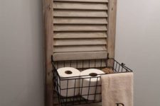 06 a bathroom shelf made of an old shutter and a metal basket is an easy DIY project