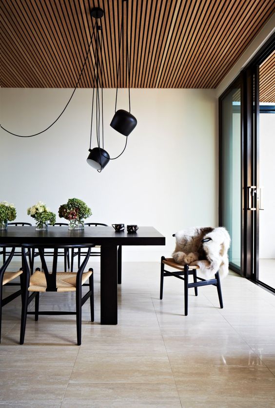 a modern wooden slab ceiling will make the space more inviting and welcoming while keeping the style