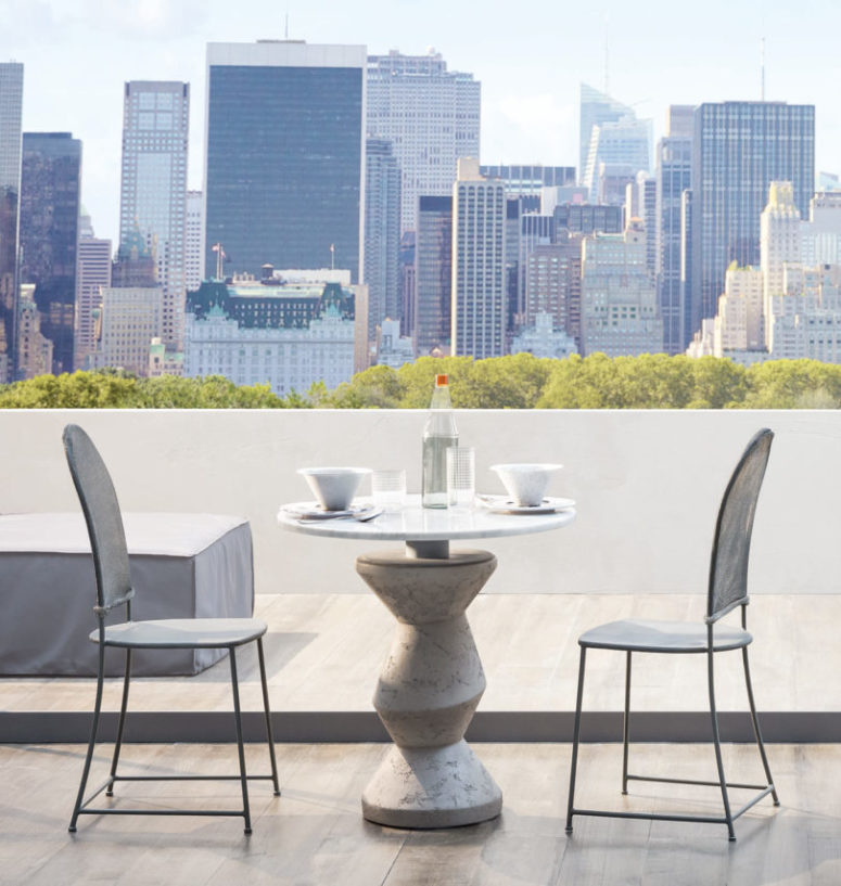 Look at this little table with a sculptural leg and a marble top, isn't it chic