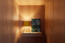 07 This is a small entryway completely clad in wood, it features doors to the powder room and exit