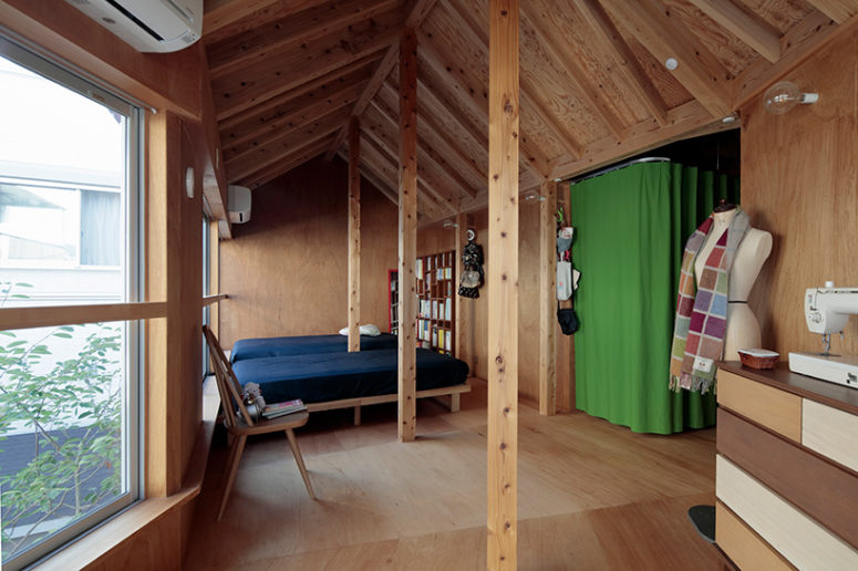 wood clad bedroom design The bedroom on the upper floor is also clad with wood, there are beams and wooden furniture, plus a view on the garden