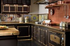 08 a Victorian steampunk inspired kitchen with a colorful tile backsplash and a copper one over the cooker