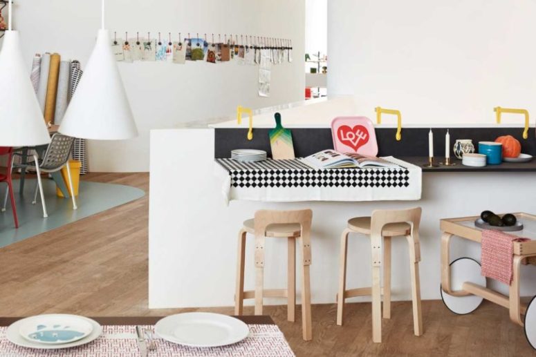 cute breakfast nook This is a small breakfast space with comfy stools and a cart, all the furniture is modern and very bright
