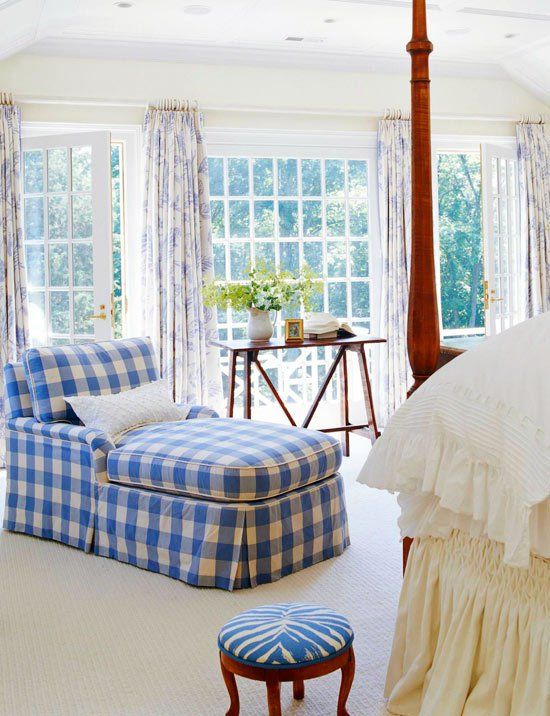 a comfy blue and white buffalo check lounger with pillows for a comfy coastal living room
