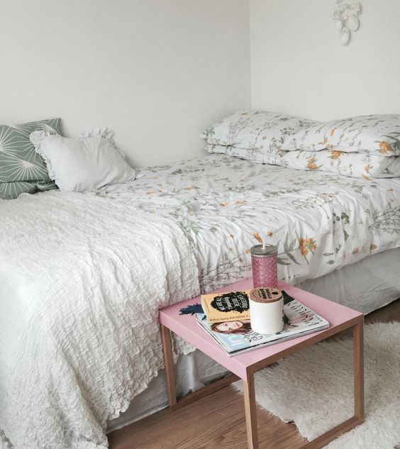 a large bed takes the whole space, and a small nightstand is all you need to add