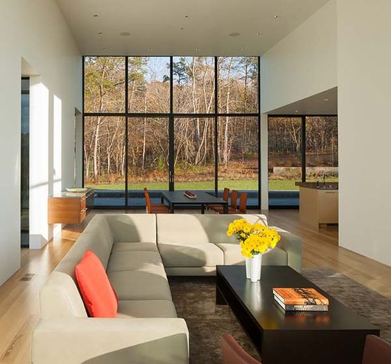 an L-shaped beige sofa is an indispensable piece for a large open layout like here