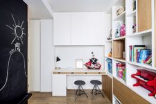 12 The second kids’ space features a chalkboard and lots of storage shelves plus a space for creating