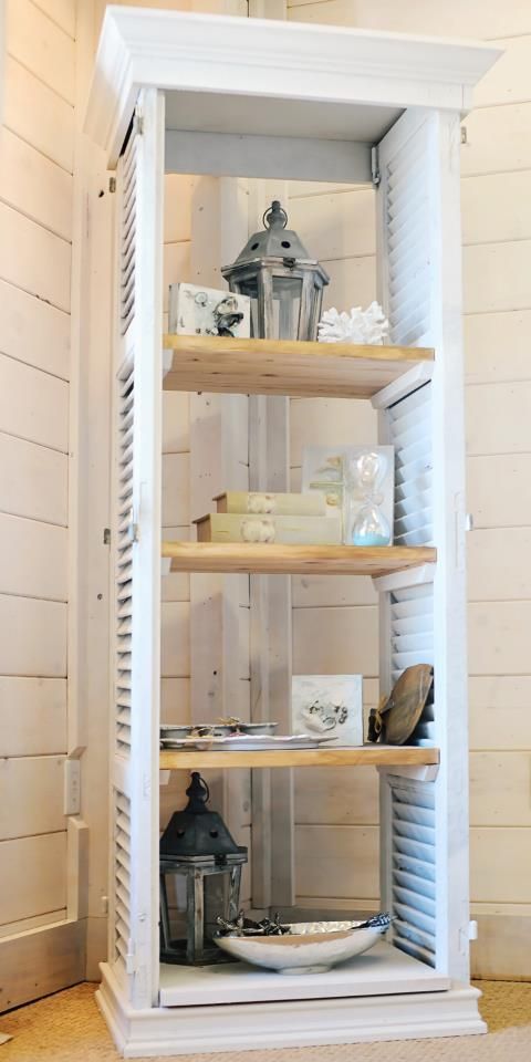 a shutter shelf with shelves and vintage items on display for a chic look