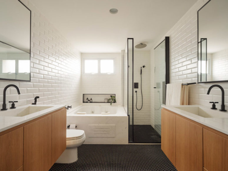penny tiled bathroom floor The master bathroom is done with white tiles, black penny ones on the floor and light-colored wood