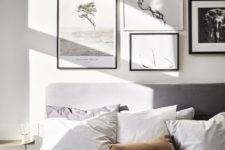 14 a black and white gallery wall with photos is a great option for a contemporary bedroom