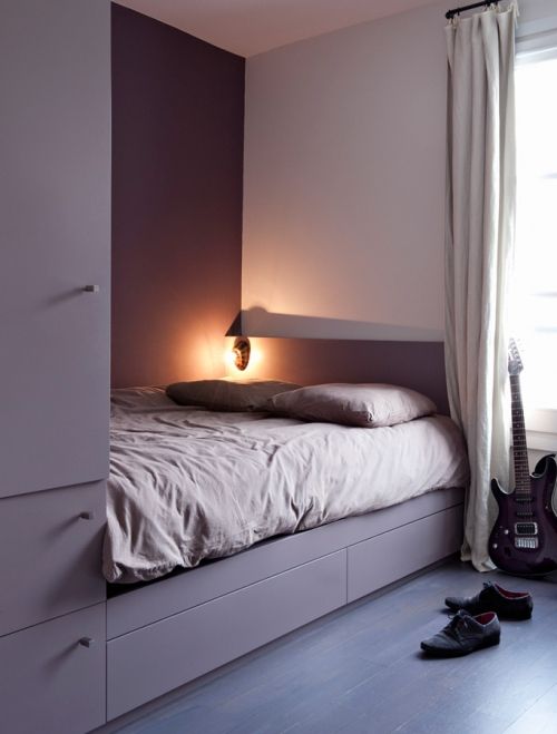 a smart built-in unit with storage compartments and a bed is a great idea to rock in a tiny room