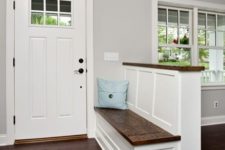 17 a farmhouse-styled pony wall with an entryway bench and a wooden countertop