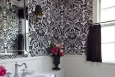 18 black and white printed wallpaper contrasts white wainscoting creating drama
