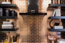 19 a copper tile backsplash and matching handles in a black kitchen to bring some chic