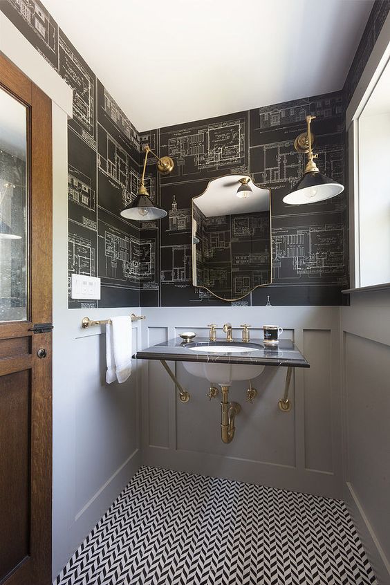 chalkboard-styled wallpaper is completed with grey wainscoting to make the space lighter