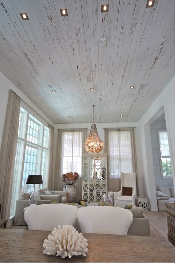 a whitewashed shabby chic ceiling for a coastal living room