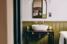 22 add a touch of color with wainscoting, here it’s olive green in a neutral vintage space