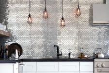 22 silver tile wall instead of a backsplash is a bold statement in the kitchen