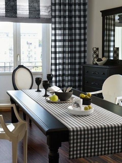 buffalo check curtains and a mtching table runner for a refined black and white dining space
