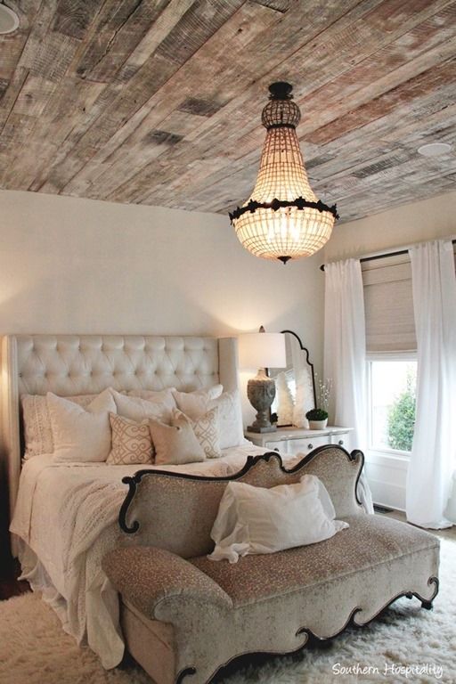 a rustic shabby chic wooden ceiling of reclaimed wood adds texture and interest
