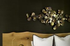 26 an amazing shiny metal wall sculpture adds a refined touch to the space