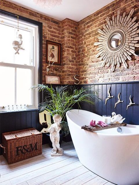 an eclectic space with exposed brick and navy wainscoting for a unique and super bold look
