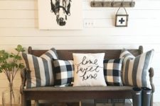 26 some buffalo check pillows are a great idea to style a rustic entryway