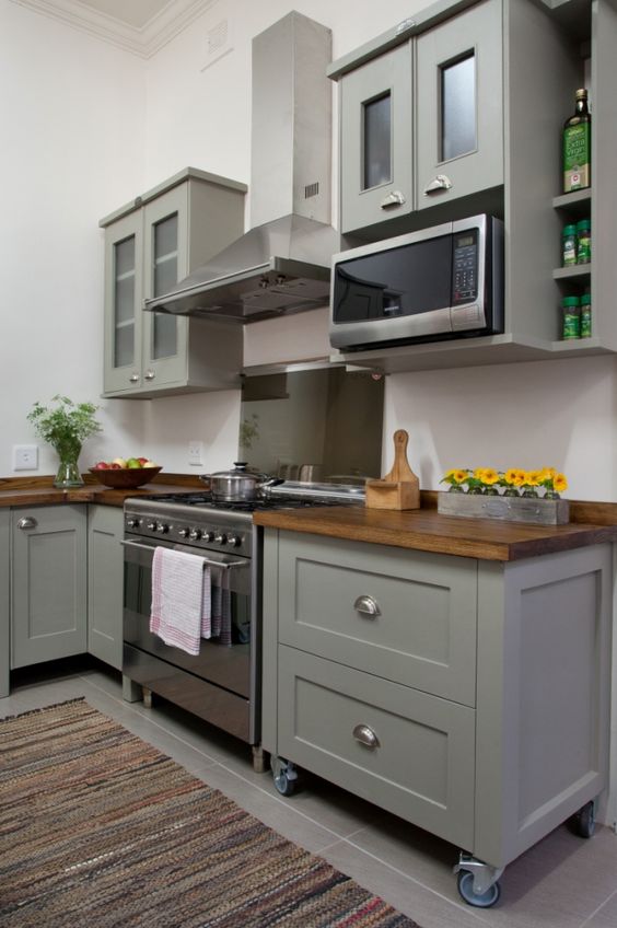 Grey Vintage Cabinets With Legs And Some Of Them Placed On Casters For Easier Moving Around The Space 