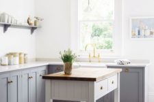 vintage-inspired grey freestanding cabinets with white marble countertops for a peaceful and welcoming kitchen