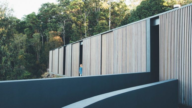 This Australian home is fully clad with timber screens that protect the house from excessive sunlight This Australian home is fully clad with timber screens that protect the house from excessive sunlight