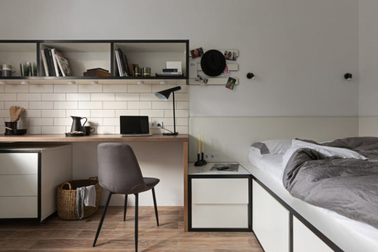 smart bed with some storage Box-shaped shelves feature additional lights, and next to the dining table-desk there's a platform bed