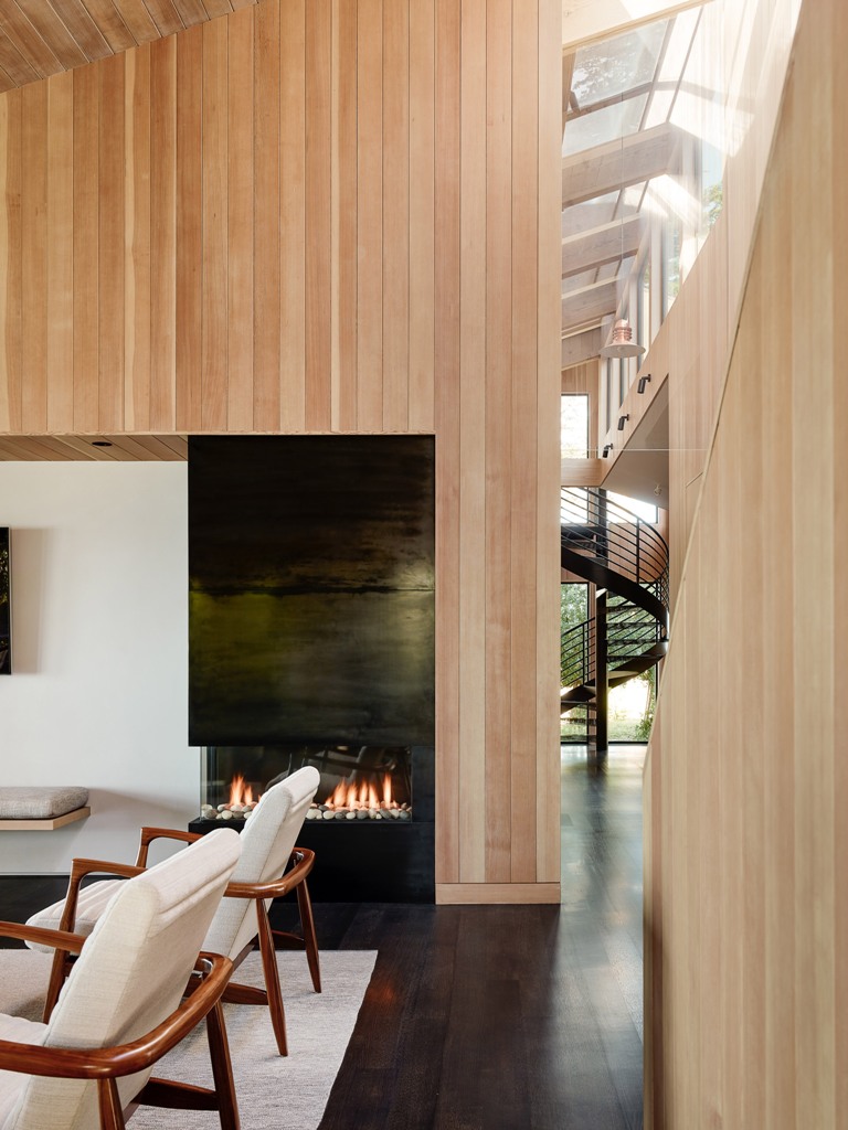 The inside of the home is clad with the same light colored wood as outside, and the color palette is comfortable and earthy The inside of the home is clad with the same light-colored wood as outside, and the color palette is comfortable and earthy