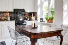 03 an antique dark stained dining table and metal chairs that create a bold contrast