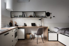 04 The furniture is modern and simple, there’s a built-in cooker, a modern hood with lights and much storage
