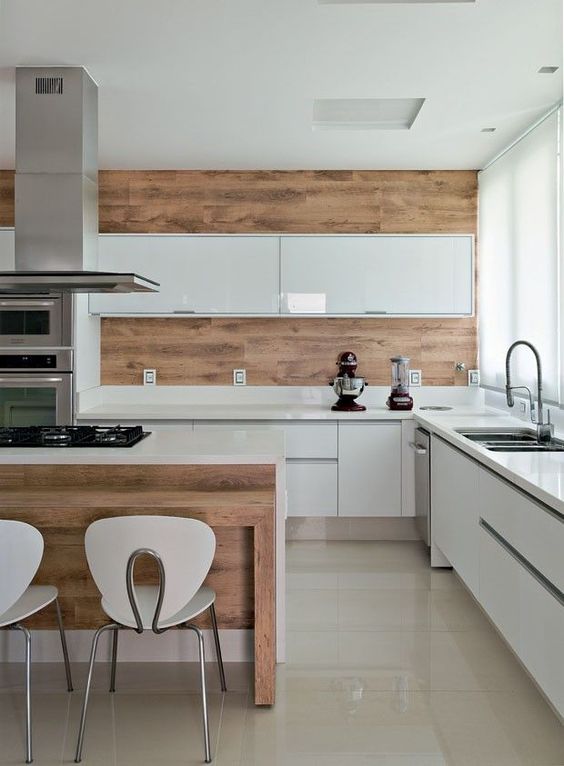 a glossy minimalist kitchen in white and rich-colored wood for a more natural feel