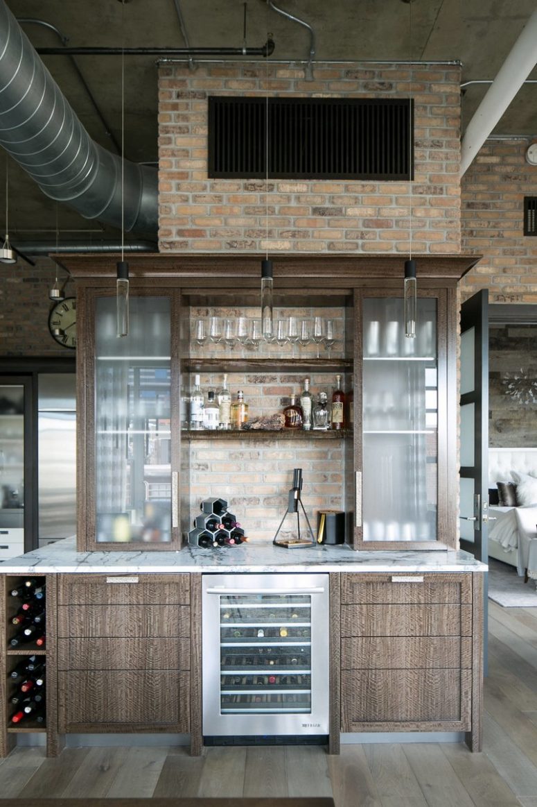 mind blowing home bar design A home bar is done with the same cabinets attached to a brick wall and cool pendant lamps illuminate it