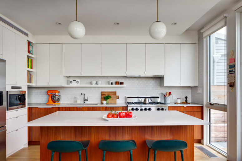 kitchen island with seating chairs The kitchen si done with white upper and stained wooden cabinets plus a comfy kitchen island