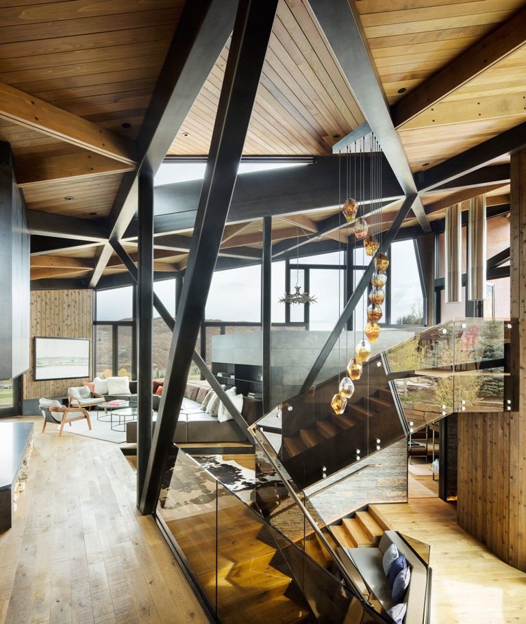 The short staircases feature mirror and glass railing and there's a fantastic pendant lamp that accents the space The short staircases feature mirror and glass railing and there's a fantastic pendant lamp that accents the space